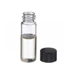 Small clear glass vial with liquid and black screw cap beside it.